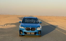 Blue BMW X1 M for rent in Dubai