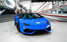 Blue Lamborghini Huracan spyder for rent in Dubai