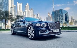 Dark Blue Bentley Flying Spur for rent in Sharjah