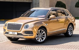 Gold Bentley Bentayga for rent in Abu-Dhabi