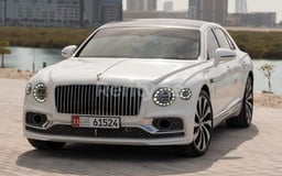 أبيض Bentley Flying Spur للإيجار في Sharjah