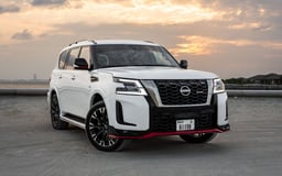 White Nissan Patrol V8 with Nismo Bodykit and latest generation interior for rent in Dubai