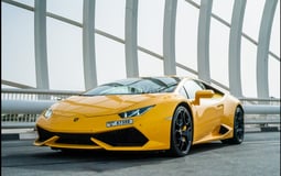 Yellow Lamborghini Huracan Coupe for rent in Sharjah