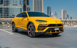 Yellow Lamborghini Urus for rent in Abu-Dhabi