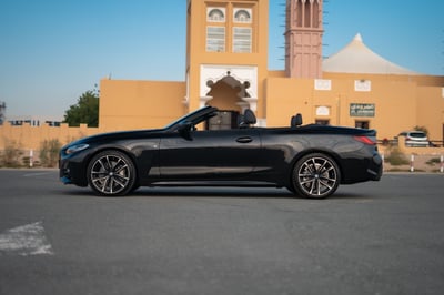 Black BMW 430i cabrio for rent in Sharjah 1