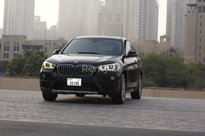 Black BMW X1 for rent in Sharjah 0