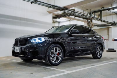 Black 2020 BMW X4 with X4M Body Kit for rent in Abu-Dhabi 0