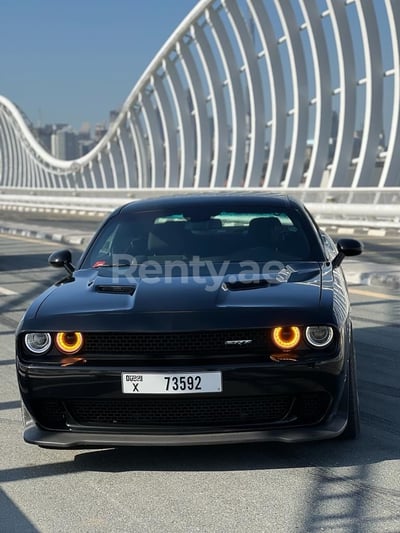 Black Dodge Challenger V6 for rent in Abu-Dhabi 0