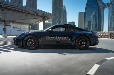 Black Porsche 911 Carrera S for rent in Dubai 0