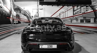 Black Porsche Taycan Turbo for rent in Dubai 1