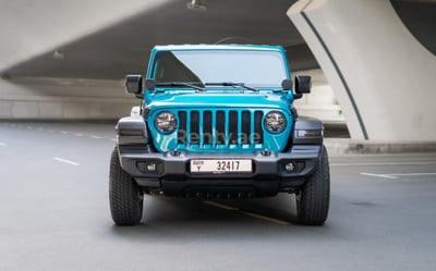 Blue Jeep Wrangler Limited Sport Edition convertible for rent in Sharjah 1