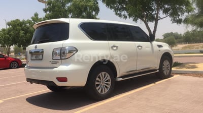 Bright White Nissan Patrol for rent in Abu-Dhabi 1