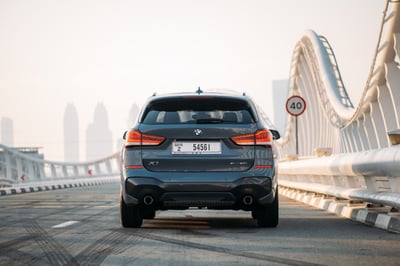 Dark Grey BMW X1 for rent in Dubai 1