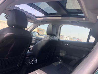 Green Alfa Romeo Stelvio for rent in Sharjah 0