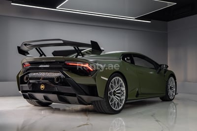 Green Lamborghini Huracan STO for rent in Dubai 0