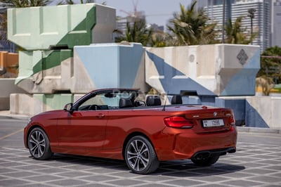 Orange BMW 230i for rent in Dubai 1