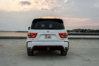 White Nissan Patrol V8 with Nismo Bodykit and latest generation interior for rent in Abu-Dhabi 1