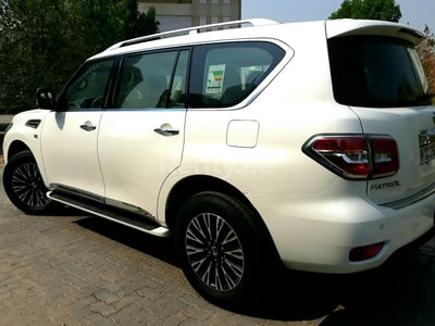 Bright White Nissan Patrol for rent in Abu-Dhabi 0