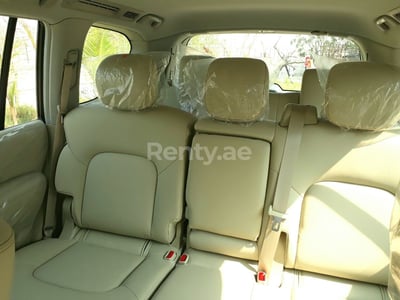 Bright White Nissan Patrol for rent in Abu-Dhabi 1