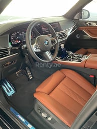 Black BMW X7 M50i for rent in Abu-Dhabi 1