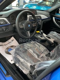 Blue BMW 318 for rent in Sharjah 5