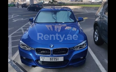 Blue BMW 318 for rent in Sharjah