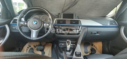 Blue BMW 318 for rent in Sharjah 6