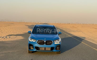 Синий BMW X1 M в аренду в Dubai