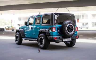 Blue Jeep Wrangler Limited Sport Edition convertible for rent in Dubai 0