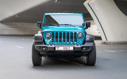 Blue Jeep Wrangler Limited Sport Edition convertible for rent in Dubai 1