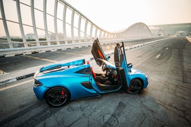 Blue McLaren 570S Spyder for rent in Dubai 2