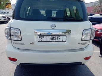 Bright White Nissan Patrol for rent in Abu-Dhabi 2