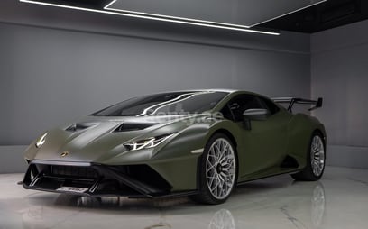 Green Lamborghini Huracan STO for rent in Dubai