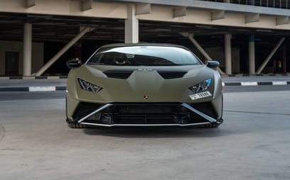 Green Lamborghini Huracan STO for rent in Dubai 0