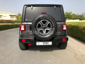 Grey Jeep Wrangler for rent in Dubai 2