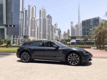 Grey Porsche Taycan for rent in Dubai 0