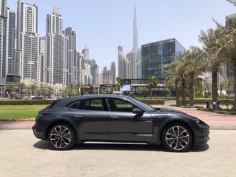 Grey Porsche Taycan for rent in Dubai 1
