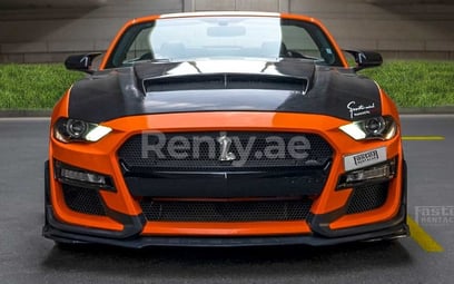 Orange Ford Mustang for rent in Dubai