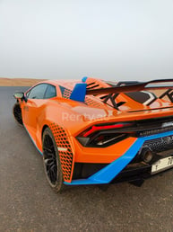 Orange Lamborghini Huracan STO for rent in Dubai 1