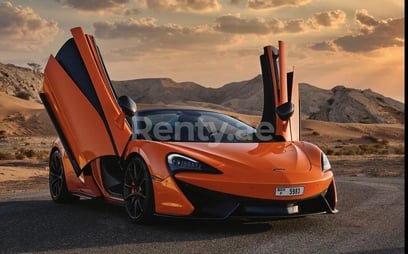 Orange McLaren 570S Spyder for rent in Sharjah