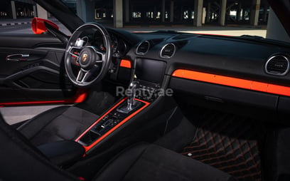 Orange Porsche Boxster 718 for rent in Dubai 5