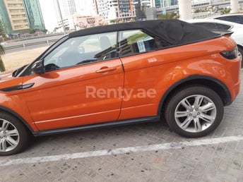 Orange Range Rover Evoque for rent in Sharjah 0