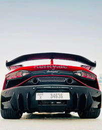 Red Lamborghini Aventador SVJ Spyder for rent in Dubai 2