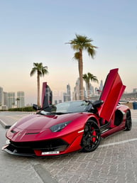 Red Lamborghini Aventador SVJ Spyder for rent in Dubai 3