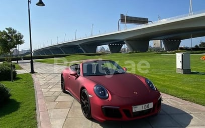 Red Porsche 911 Carrera GTS cabrio for rent in Abu-Dhabi