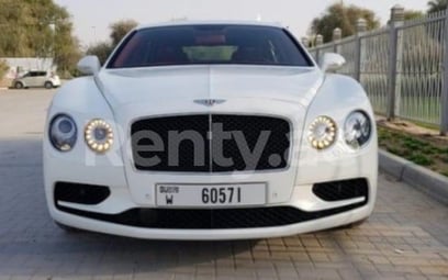 White Bentley Flying Spur for rent in Sharjah