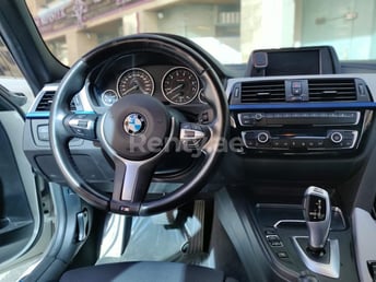 White BMW 318 for rent in Abu-Dhabi 2