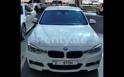 White BMW 318 for rent in Sharjah