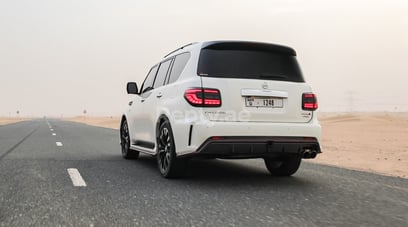 White Nissan Patrol V8 with Nismo Bodykit for rent in Dubai 1