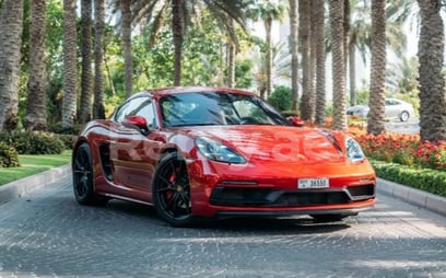 Red Porsche Cayman GTS for rent in Dubai